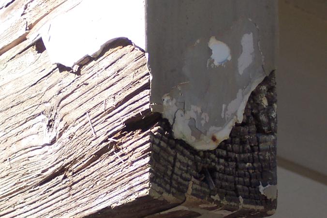 (B) Rotting exposed beam end, close up