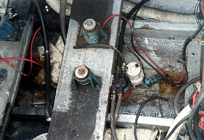 Inboard/Outboard engine mount with steel pedestals through-bolted on a chopper-glassed wood beam.