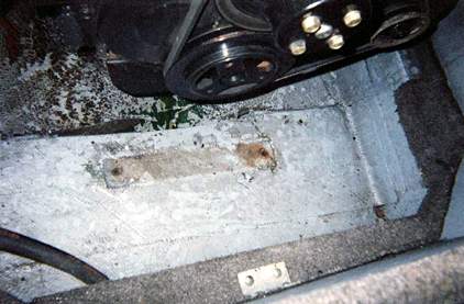 Engine mount bracket removed showing the sunken area under the bracket due to rotted wood