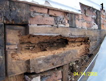 Foundation wall with dry deteriorated wood (1)