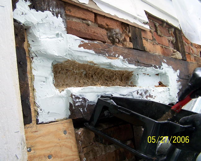 Foundation wall coated with L&L mixed with sawdust as bedding for new wood (4)