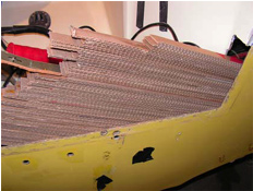 starboard side of transom with cardboard strips being removed