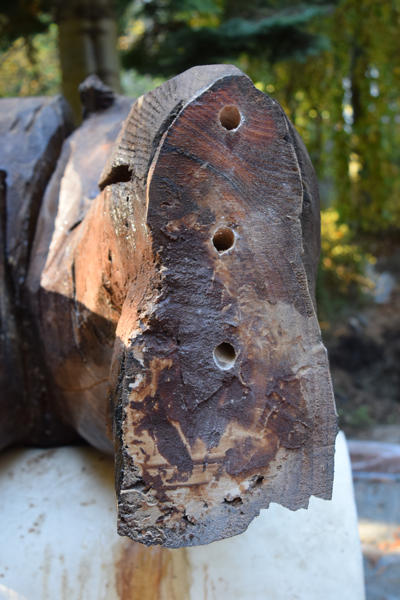 Holes drilled into the right foot for the mounting rods