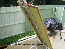 Hoisting Plywood to Deck